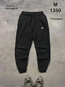 Nike утеплені спортивні штани чорні - розмір M - фото 1